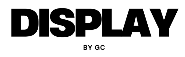 Black text 'DISPLAY BY GC' on a white background